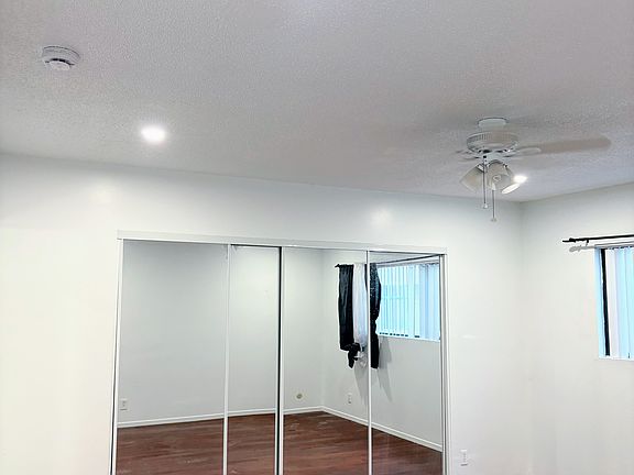 Mirrored closet doors, large window natural light