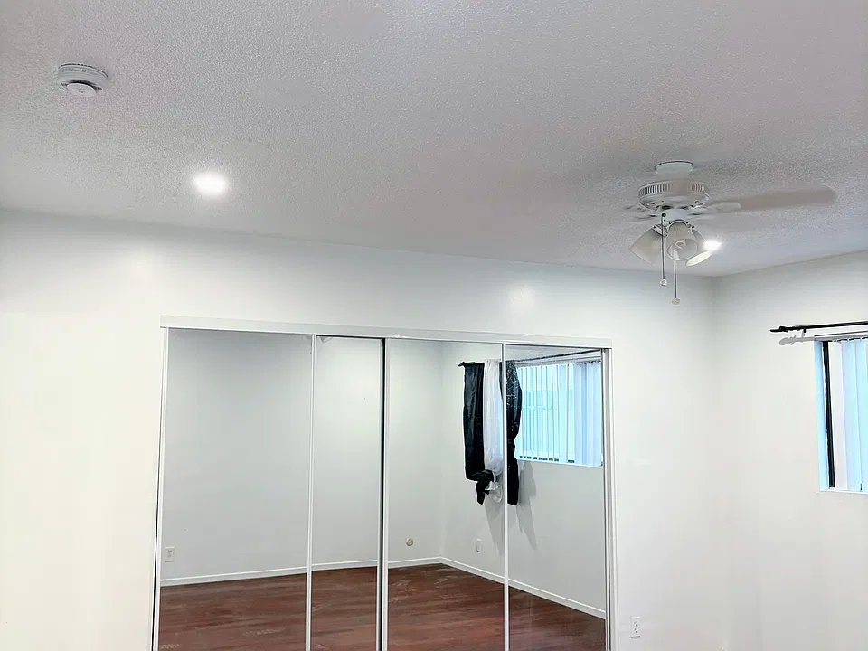 Mirrored closet doors, large window natural light