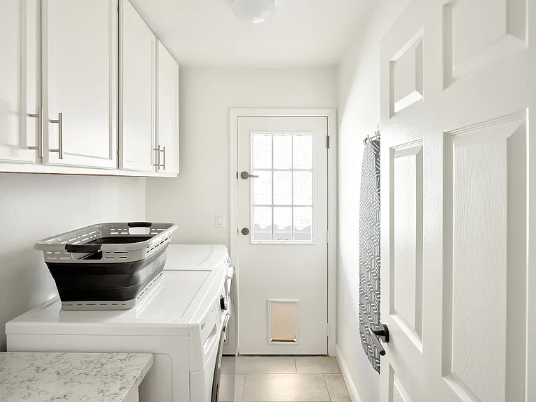 Laundry Room w/Pet Door leads to dog run