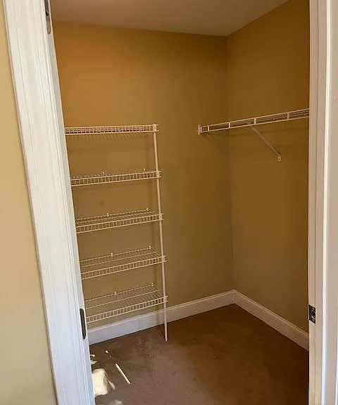 View from bathroom. Looking into master walk-in closet