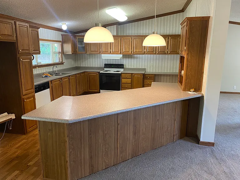 View from Breakfast area to Kitchen and Bar countertop.