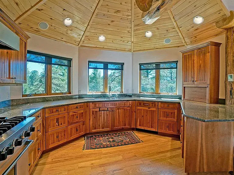 Kitchen looking toward bay window and sink