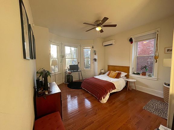 Bedroom with western bay window over looking back yard garden (cherry willow!)