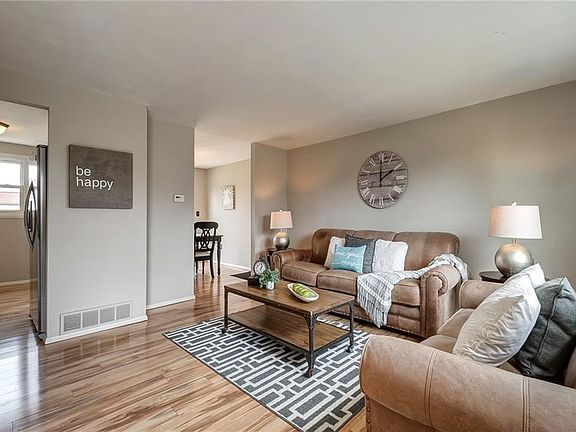 All new flooring and neutral paint in this spacious living area, ready for you to make it your own.