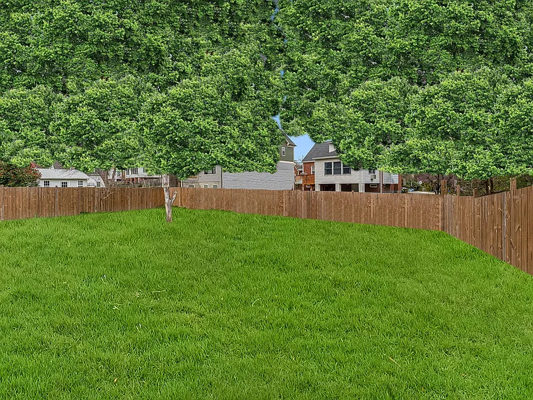 Another view of rear fenced yard