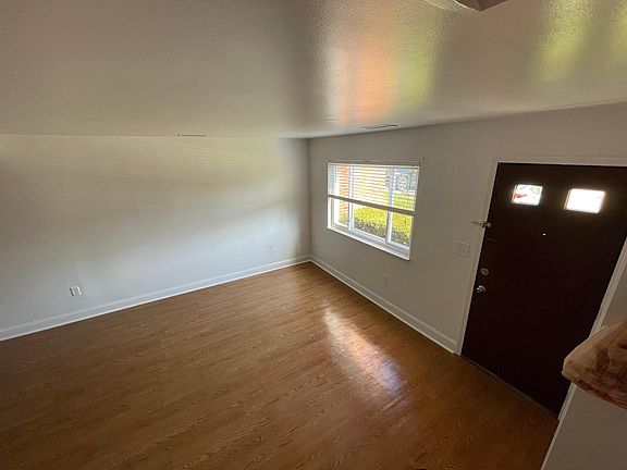Entry door into open and spacious living room.