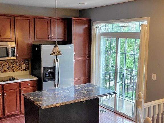a corner of kitchen opens to a spacious balcony, offering fresh air and abundant natural light.