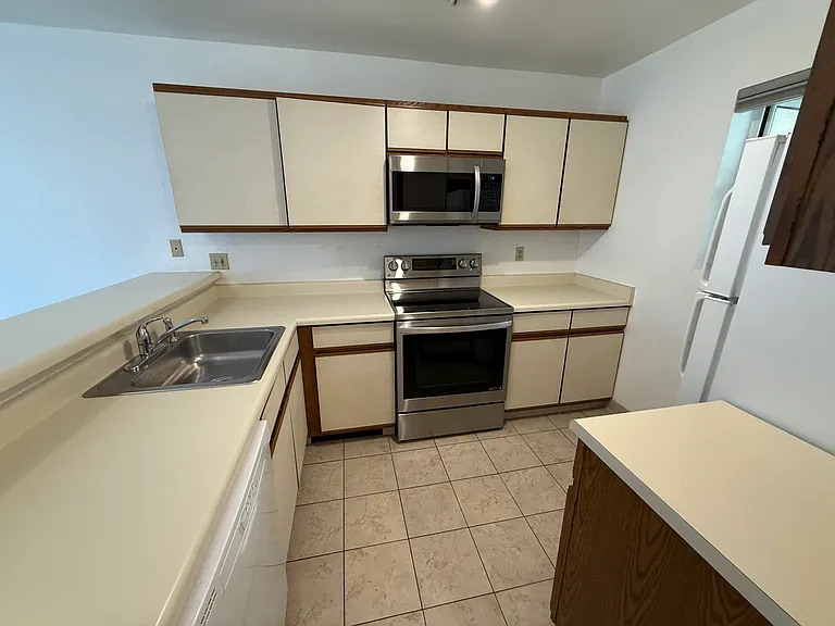 Ample Kitchen, new stove and microwave.