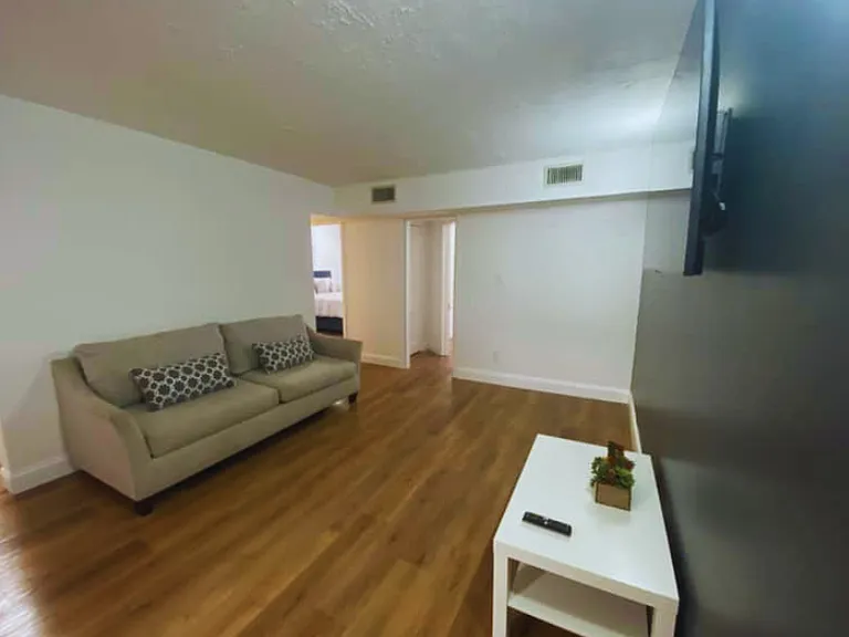 Spacious and sun-filled living area designed for comfort and relaxation.