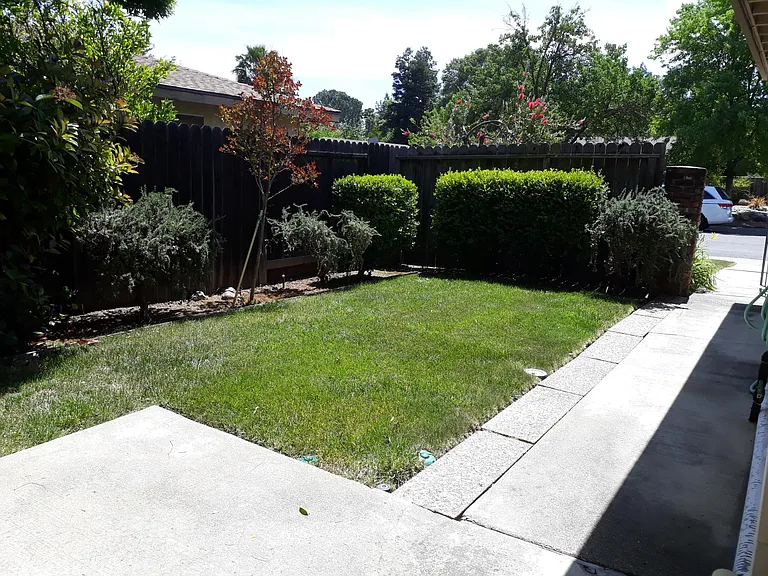 Front courtyard. There is an iron gate to outside.