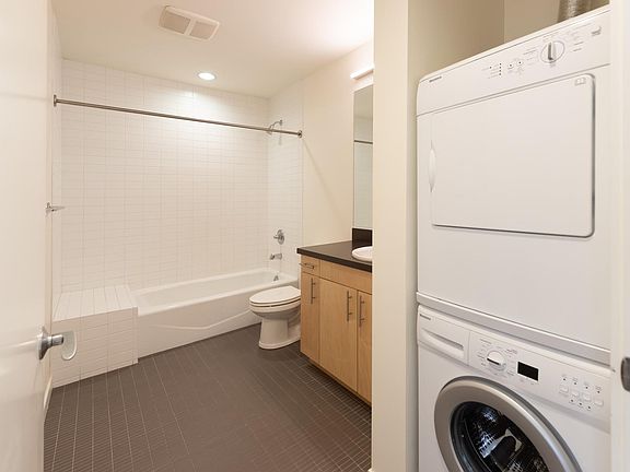 Large bathroom with stacked w/d