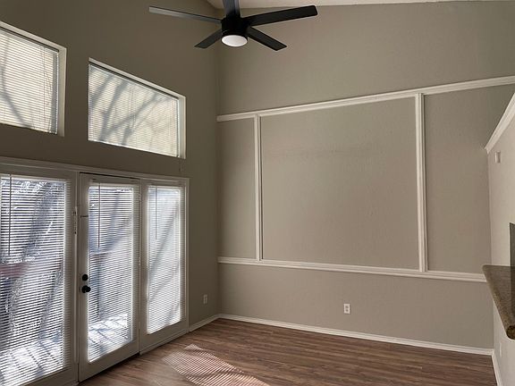 High ceilings and lots of windows and light in the living room.