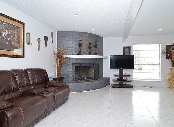 Spacious family room with corner fireplace