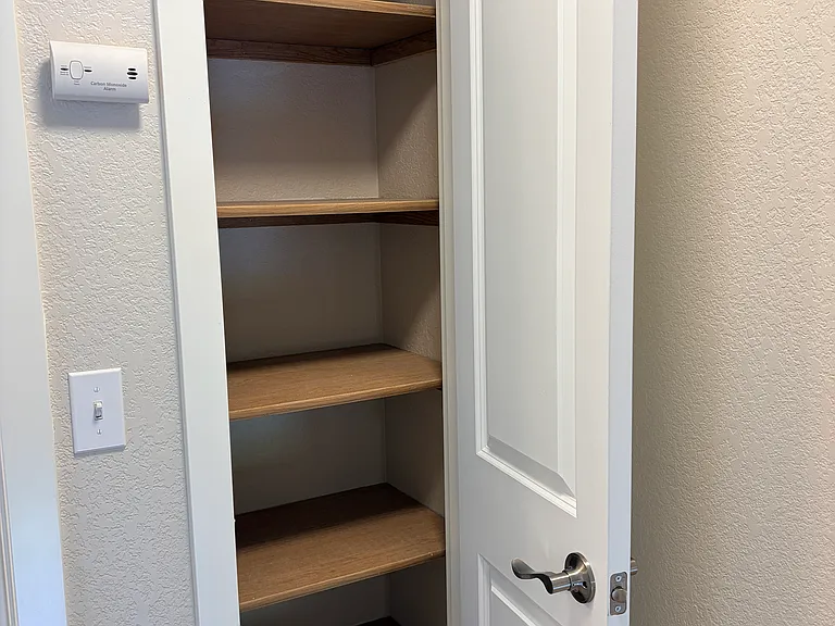 Storage!! Upstairs linen closet right where you need it with multiple deep shelves.