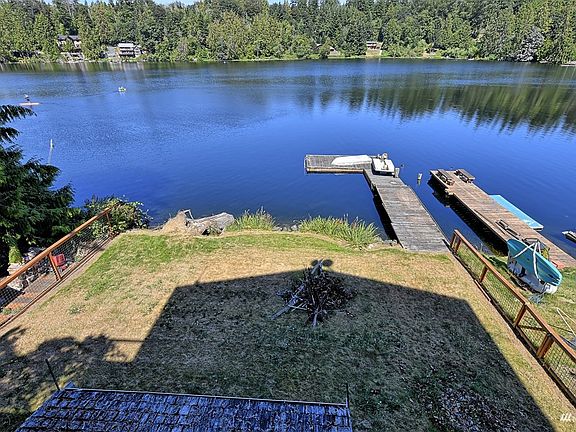 Approximately 60 ft of waterfront, large level front lot, dock...just bring your paddle boards.>