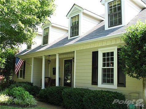 This beautiful cape cod home rests on a shady, quiet culdesac. Sit on this southern porch & enjoy a 