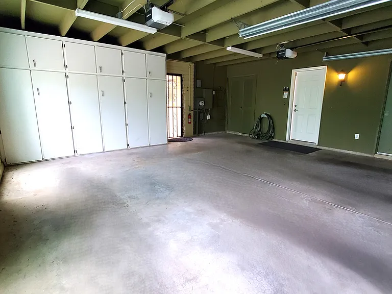 Garage storage large cabinets, entrance to laundry room.