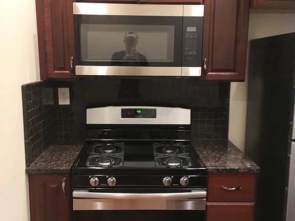 New stainless steel range, microwave, fridge, & dishwasher.