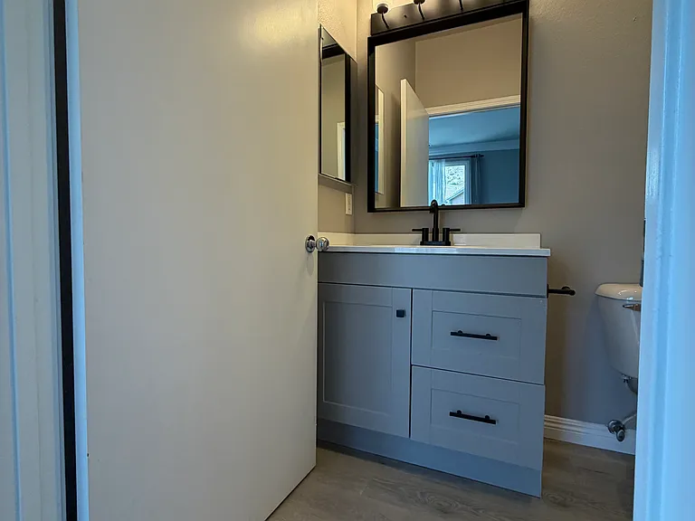 Stylishly renovated primary bathroom.