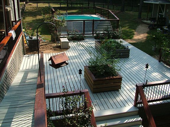 Deck, raised gardens and swimming pool