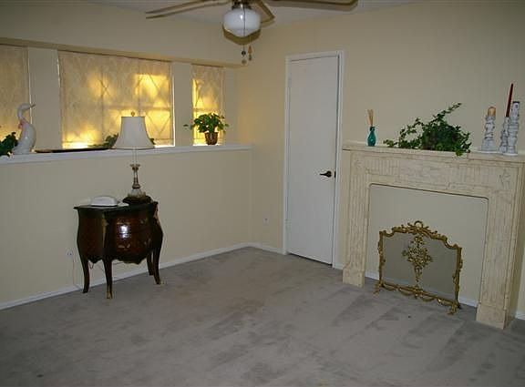 Large guest bedroom with walk-in cedar closet and ceiling fan