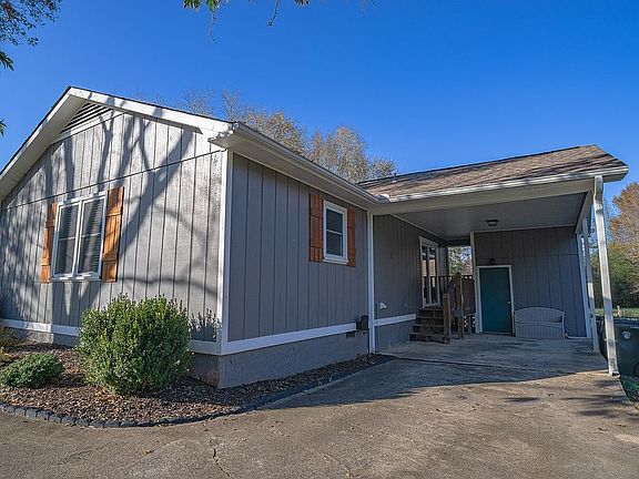 Carport with storage room