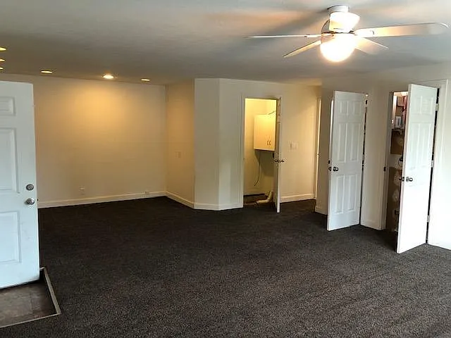 The room past the doors is the Laundry room. It also has a door to the back yard. Just between the laundry room and the water heater closet is the doorway to the kitchen. The door to the far left of this pic is the way into the garage.