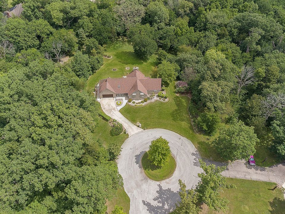 Wow! This home is ideally located on a large cul-de-sac lot just over an acre in size! The back of t