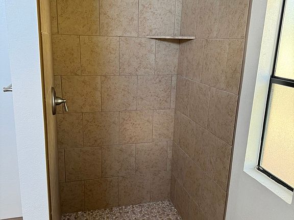newly renovated walk in tile shower.
