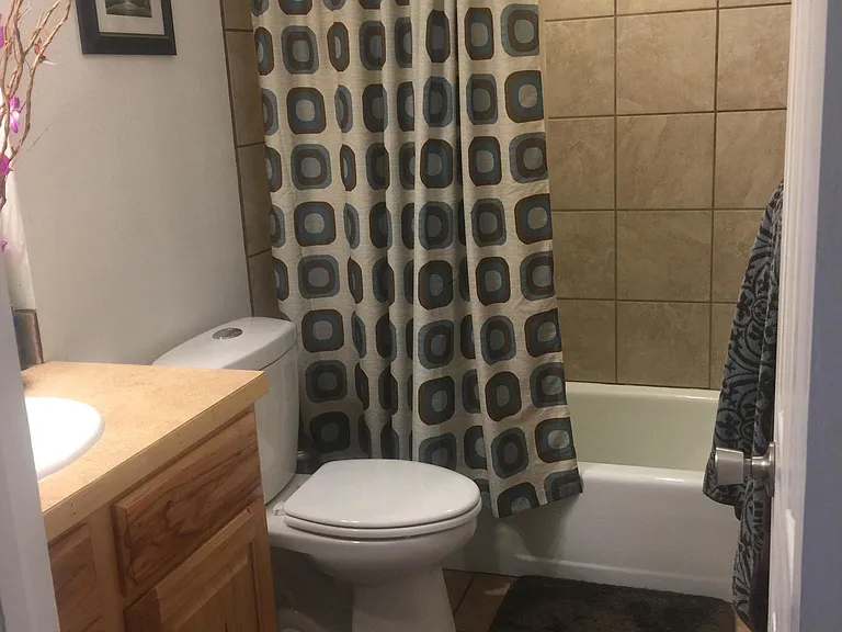 Upstairs remodeled bathroom with shower and bathtub