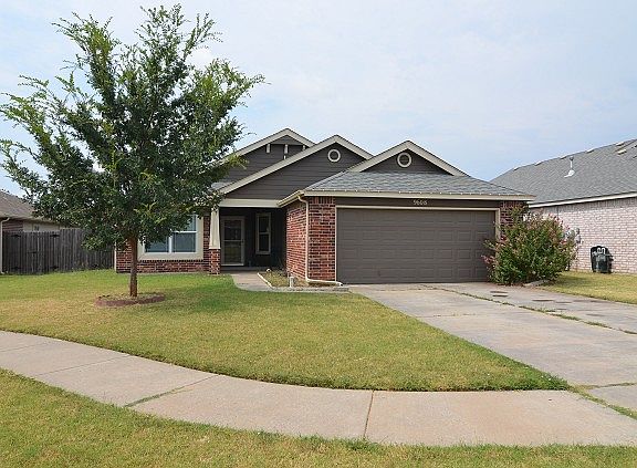 Sidewalk and fenced yard