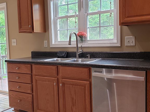 Kitchen windows with natural light adjacent to Dining with access to rear deck