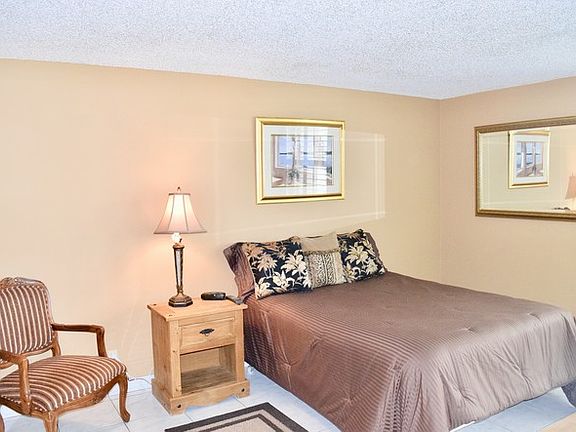 Large master bedroom with lake view