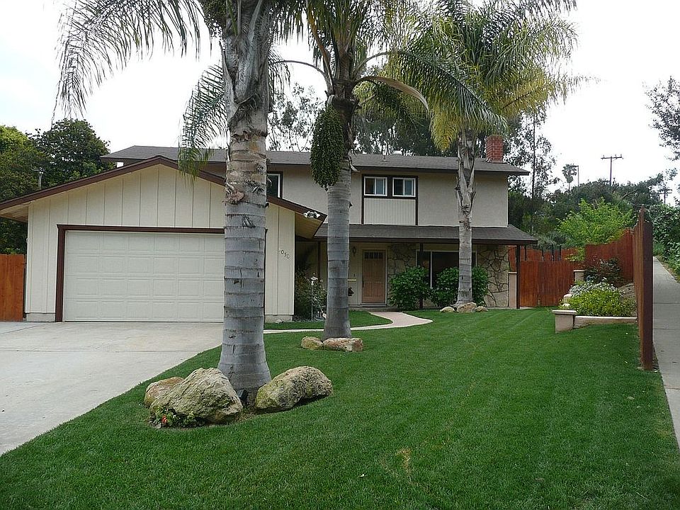 Great curb appeal, gorgeous palm trees, 2 car garage with long driveway in a C