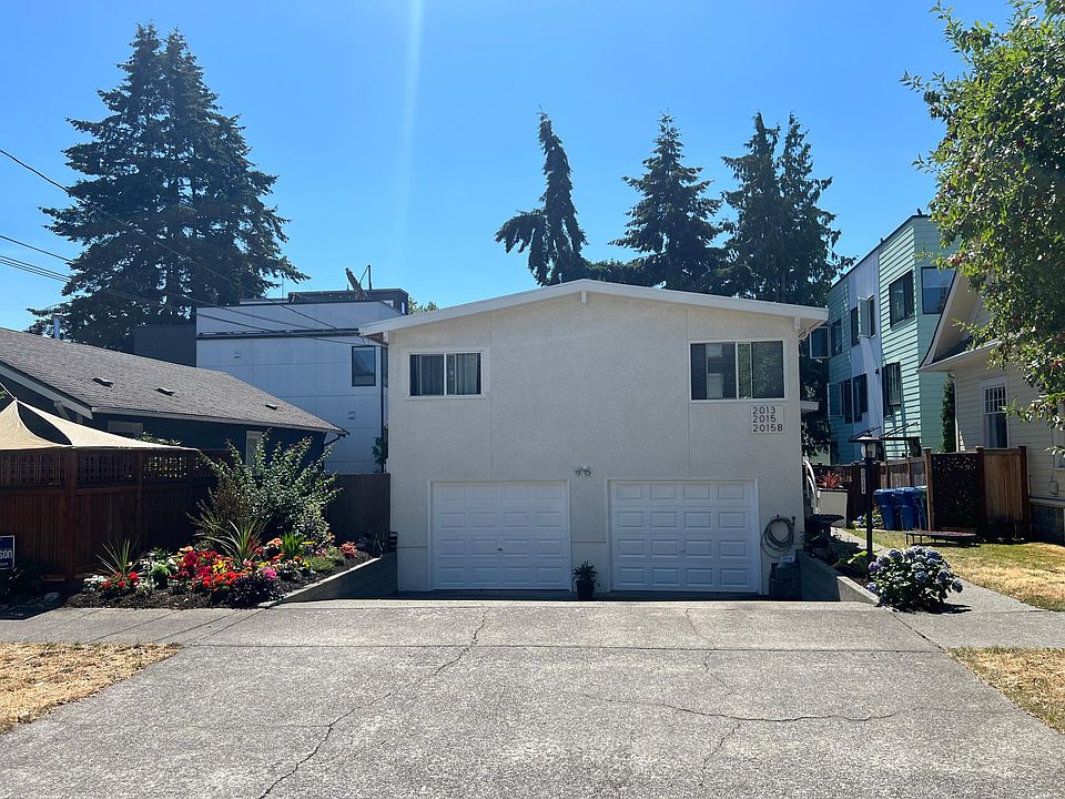 2bed 1bath and garage space located on left side with parking in front of the garage