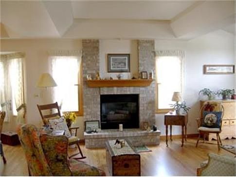 Beautiful wood floors in living room with fireplace