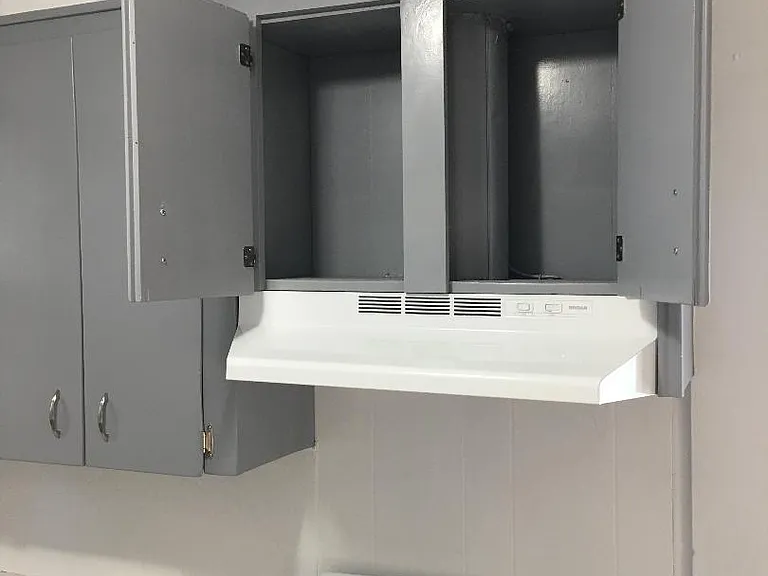 The gray and white theme carries through the whole house starting with the kitchen and covering all three bedrooms.