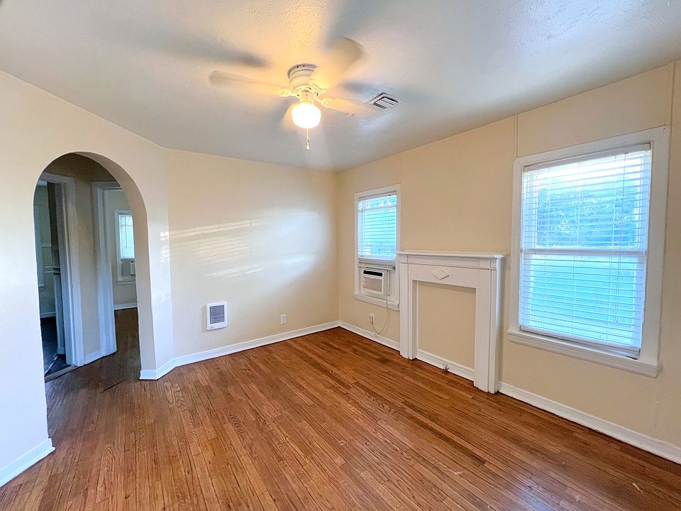 Living Room with in wall heater and ac unit