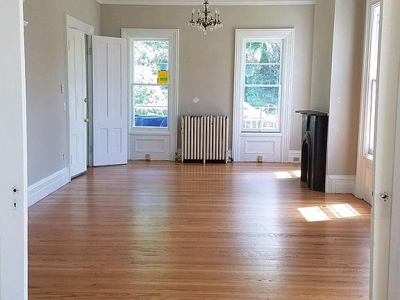 Looking from Bedroom 1 through ten foot pocket doors to the living/dining room