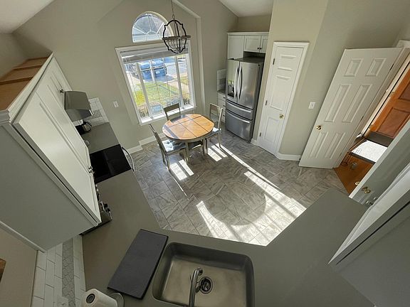 Eat in kitchen with loads of cabinet space and pantry Di