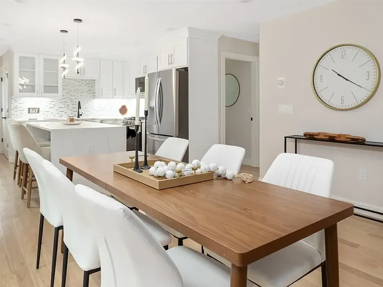 Seamless flow from the kitchen to the dining area_perfect for entertaining friends or family.