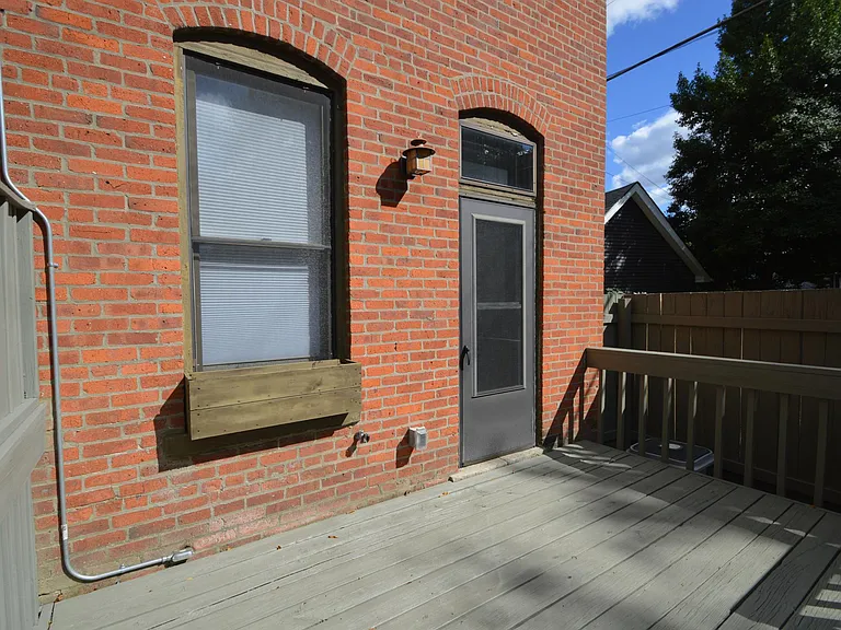 Deck and privacy fence. New storm door with pet flap installed in 2025.