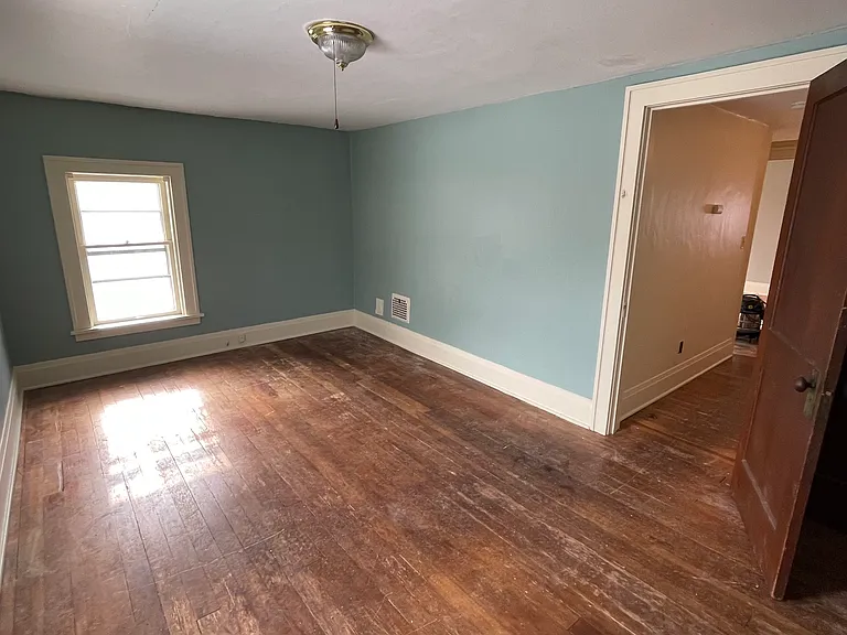 Original hardwood floors throughout entire upstairs, 3 bedrooms. Freshly painted.
