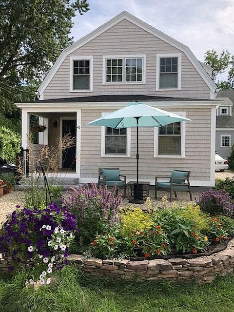 Front of house with garden and patio
