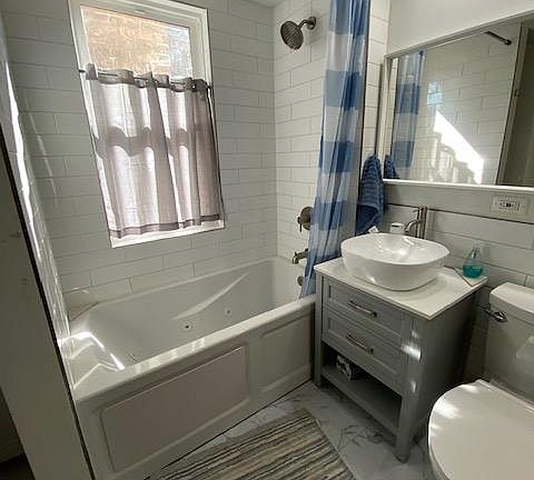 bathroom view with bathub with jet.