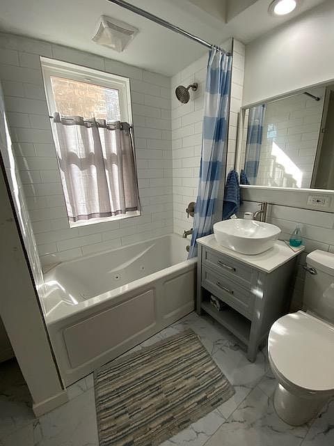 bathroom view with bathub with jet.