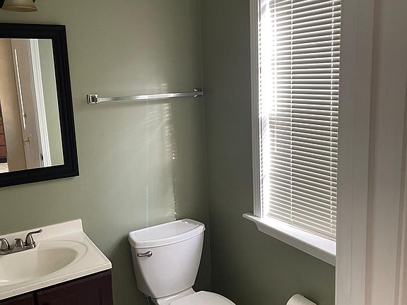 Guest bathroom off foyer.