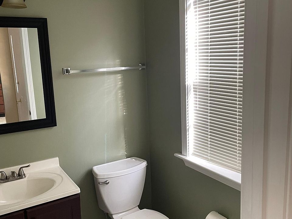 Guest bathroom off foyer.