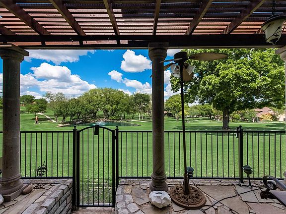 Detailed view showcasing Hole 7 of the golf course, as seen from the inviting patio area.