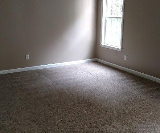 Large Master Bedroom with new carpeting